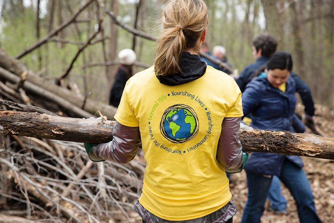 volunteers in the woods caring wood